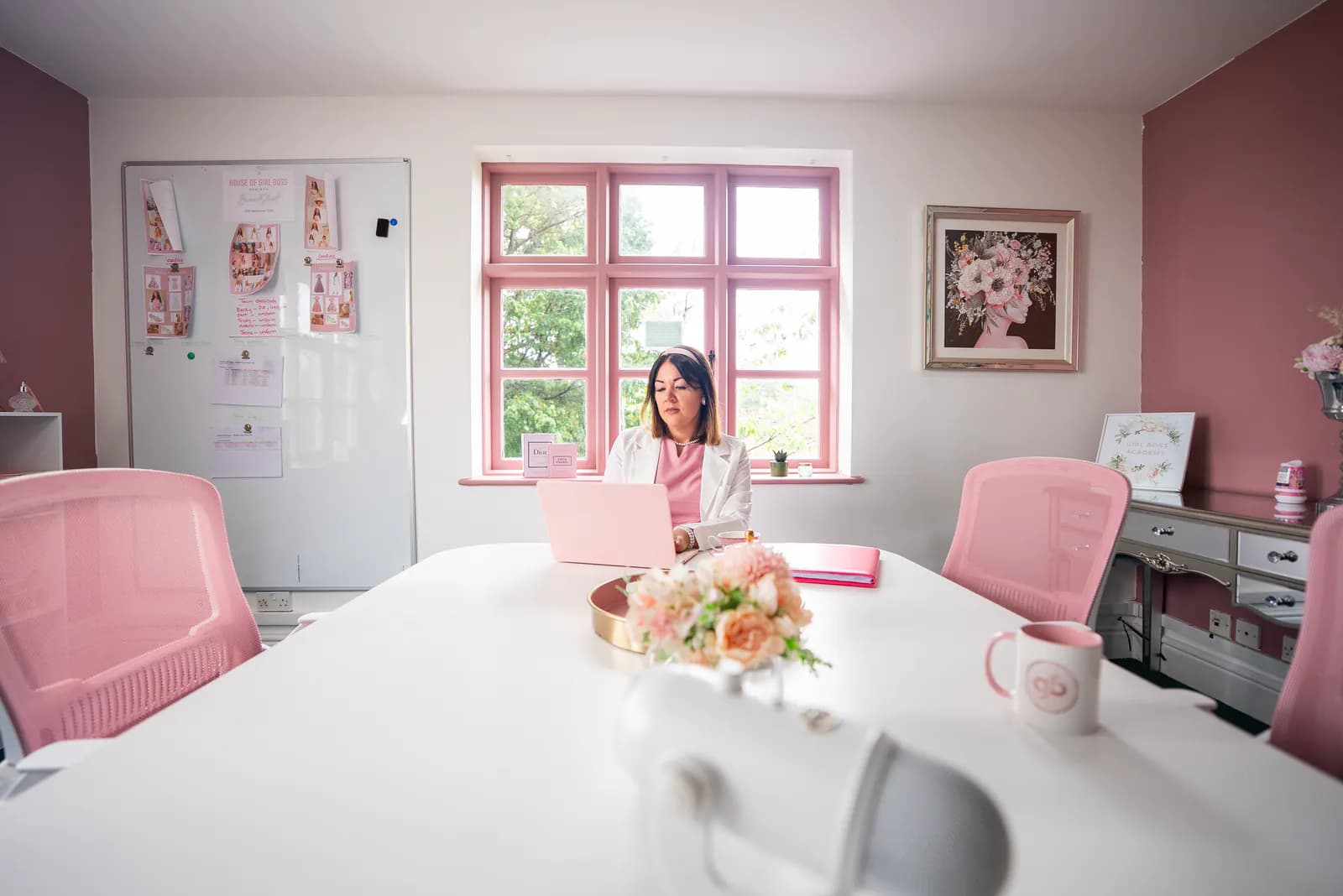 The House of GirlBoss office, with working documents visible on the board.