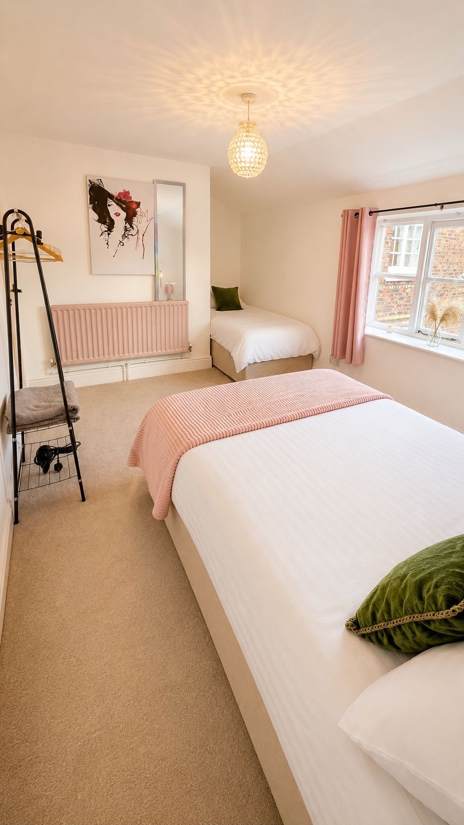 The master suite bedroom at Cherry Tree House, made up and lit by a window